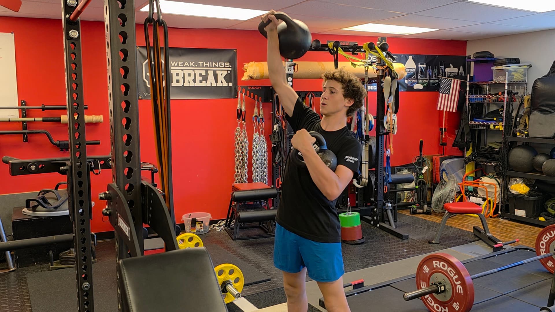 Athlete doing a kettlebell press at VVV Athletics