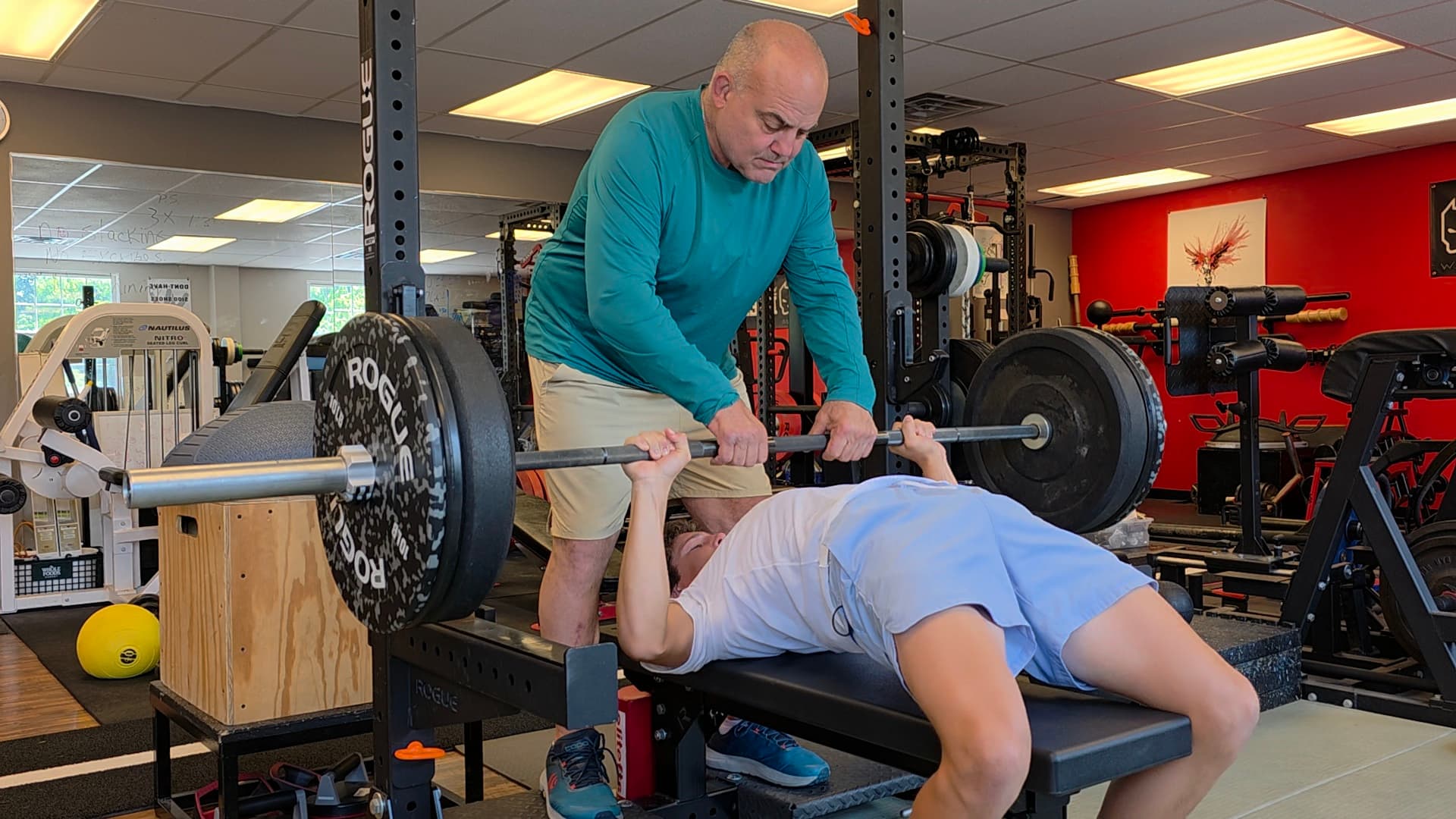 Vic spotting an athlete on the bench press